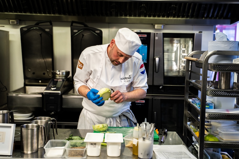 Dutch Sodexo chef Robert Janse preparing his award-winning dish: Smoked kohlrabi with miso, white bean cream and kombucha beurre blanc
